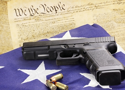 A handgun with three bullets